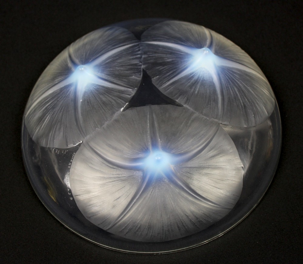 A circular Rene Lalique opalescent glass bowl featuring three relief-moulded morning glory flowers whose stems extend to form feet on the underside. View IV