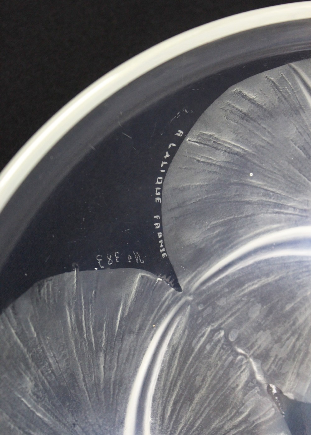A circular Rene Lalique opalescent glass bowl featuring three relief-moulded morning glory flowers whose stems extend to form feet on the underside. View V