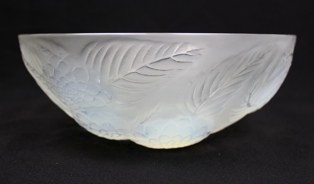 An Art Deco opalescent glass circular bowl featuring a moulded relief design of dahlia flower heads and leaves with subtle blue highlights. View II