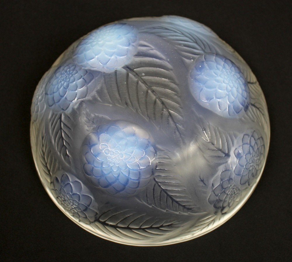 An Art Deco opalescent glass circular bowl featuring a moulded relief design of dahlia flower heads and leaves with subtle blue highlights. View III