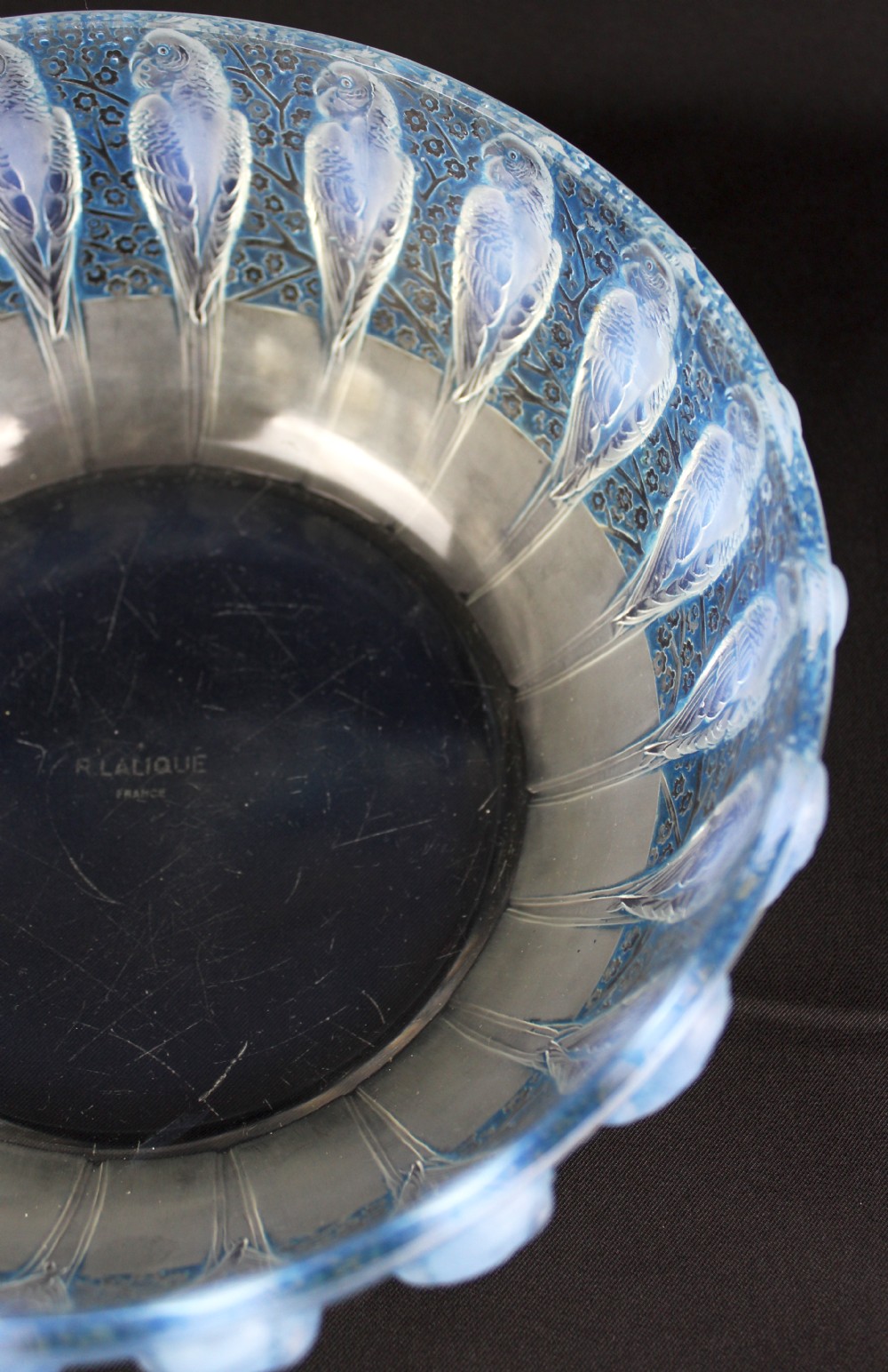 An Art Deco opalescent glass bowl decorated with a continuous molded relief pattern of parakeets perched among flowering branches. View V