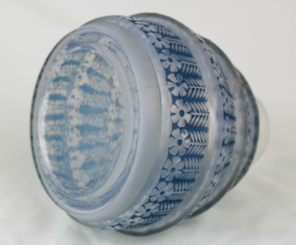 A conical frosted glass vase featuring stepped tiers with relief-moulded floral and leaf motifs highlighted in blue staining. View II
