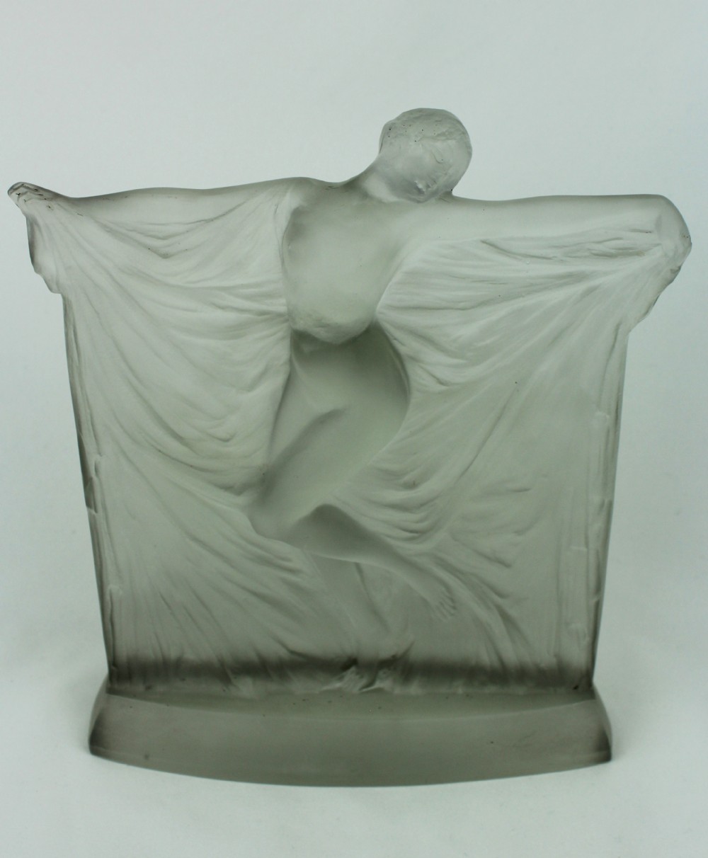 A frosted glass Art Deco statuette depicting a female figure with outstretched arms holding flowing drapery on a curved base. View III