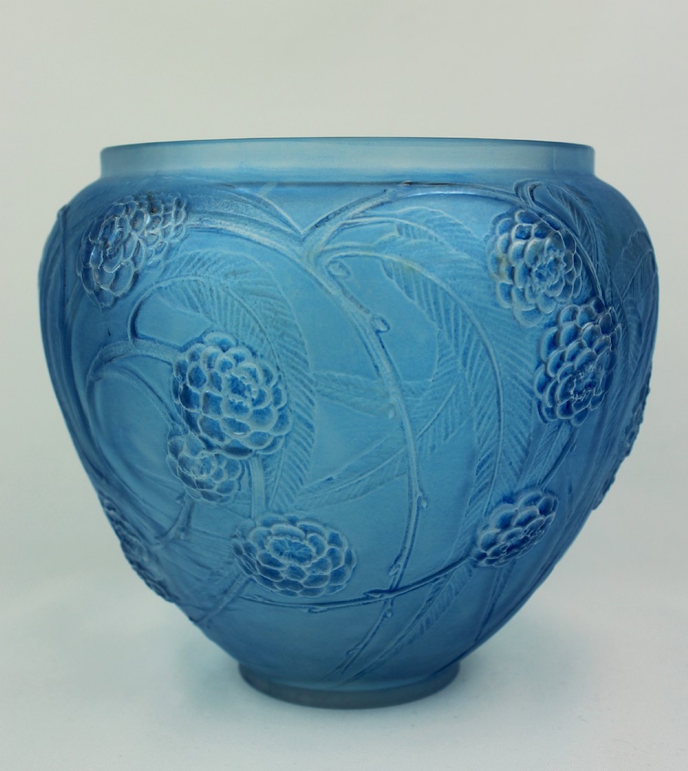 A spherical frosted blue glass vase decorated with moulded floral and leaf relief patterns across the exterior surface. View II
