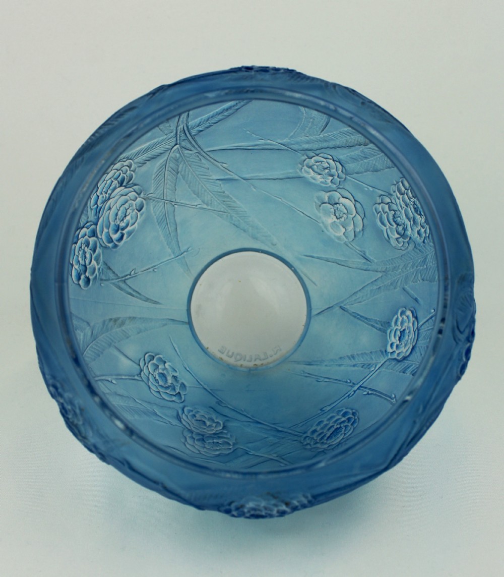 A spherical frosted blue glass vase decorated with moulded floral and leaf relief patterns across the exterior surface. View IV