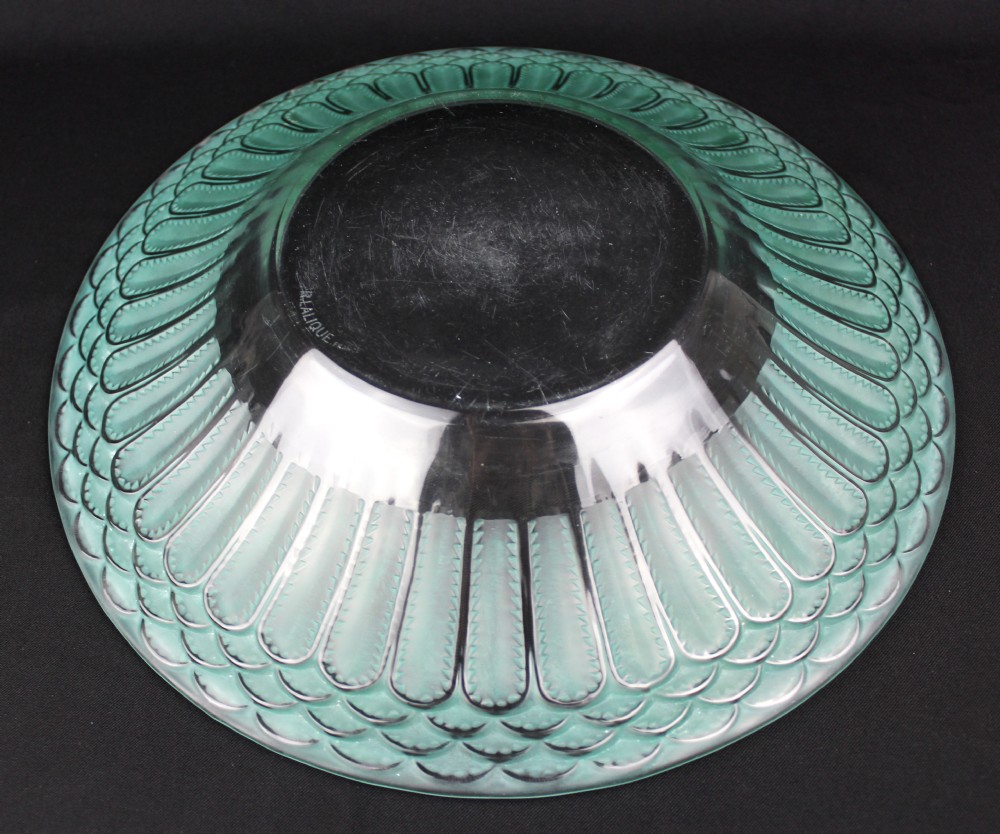 A circular Art Deco Rene Lalique clear glass bowl featuring a wide rim decorated with teal green stained geometric scalloped motifs. View II