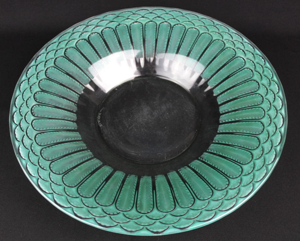 A circular Art Deco Rene Lalique clear glass bowl featuring a wide rim decorated with teal green stained geometric scalloped motifs. View V