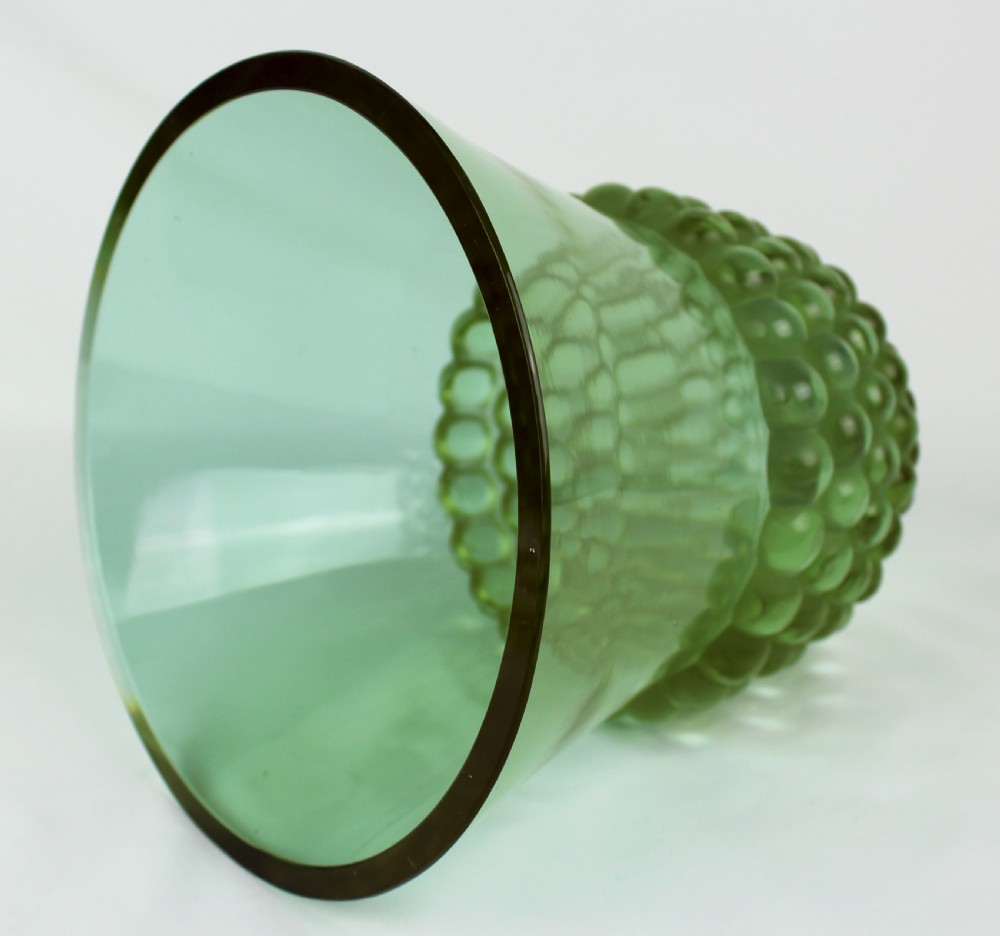 An Art Deco green glass vase featuring a smooth flared upper body and a base textured with raised spherical cabochons. View IV