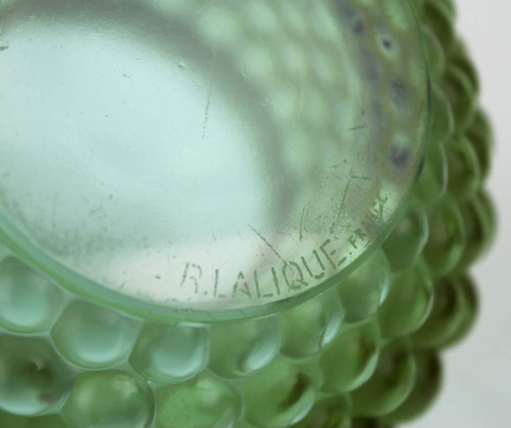An Art Deco green glass vase featuring a smooth flared upper body and a base textured with raised spherical cabochons. View VII