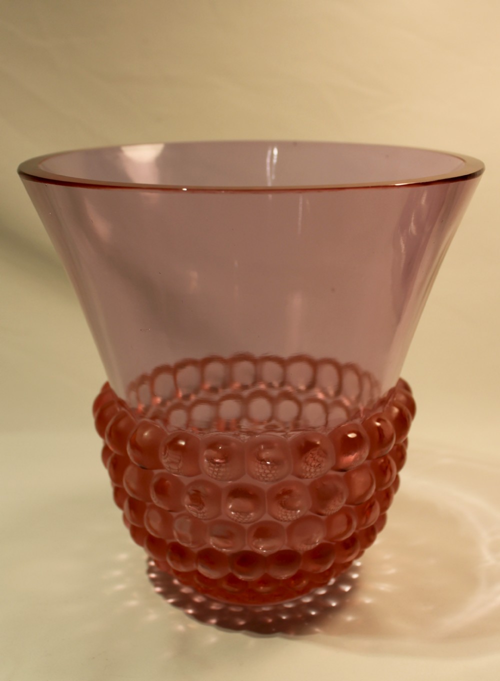 An Art Deco green glass vase featuring a smooth flared upper body and a base textured with raised spherical cabochons. View VIII
