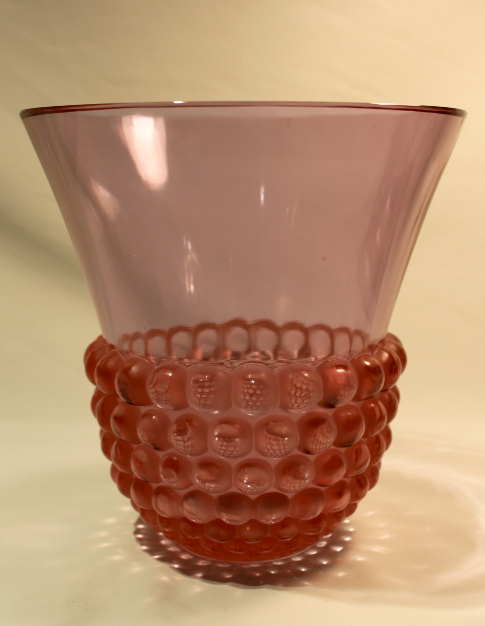 An Art Deco green glass vase featuring a smooth flared upper body and a base textured with raised spherical cabochons. View IX
