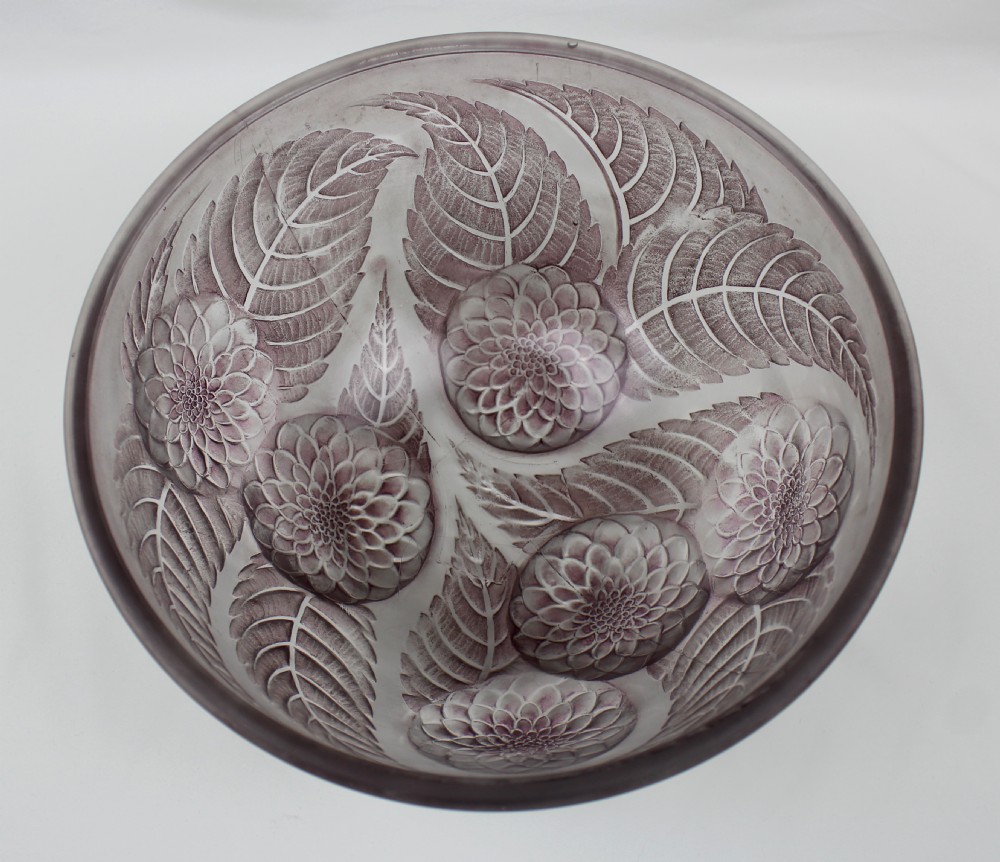 A hemispherical frosted glass light shade featuring raised relief mouldings of dahlia blossoms and leaves in a light mauve shade. View II