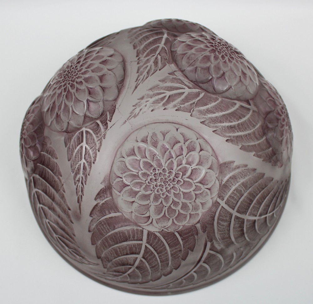 A hemispherical frosted glass light shade featuring raised relief mouldings of dahlia blossoms and leaves in a light mauve shade. View III