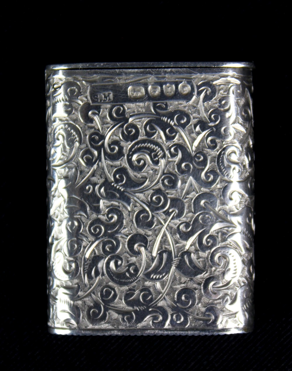 A rectangular sterling silver vesta case featuring hand-engraved foliate scrollwork and an unengraved circular central cartouche. View VIII
