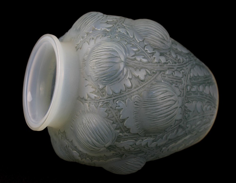 An Art Deco opalescent frosted glass vase featuring relief-moulded thistle motifs with translucent blue tones. View II