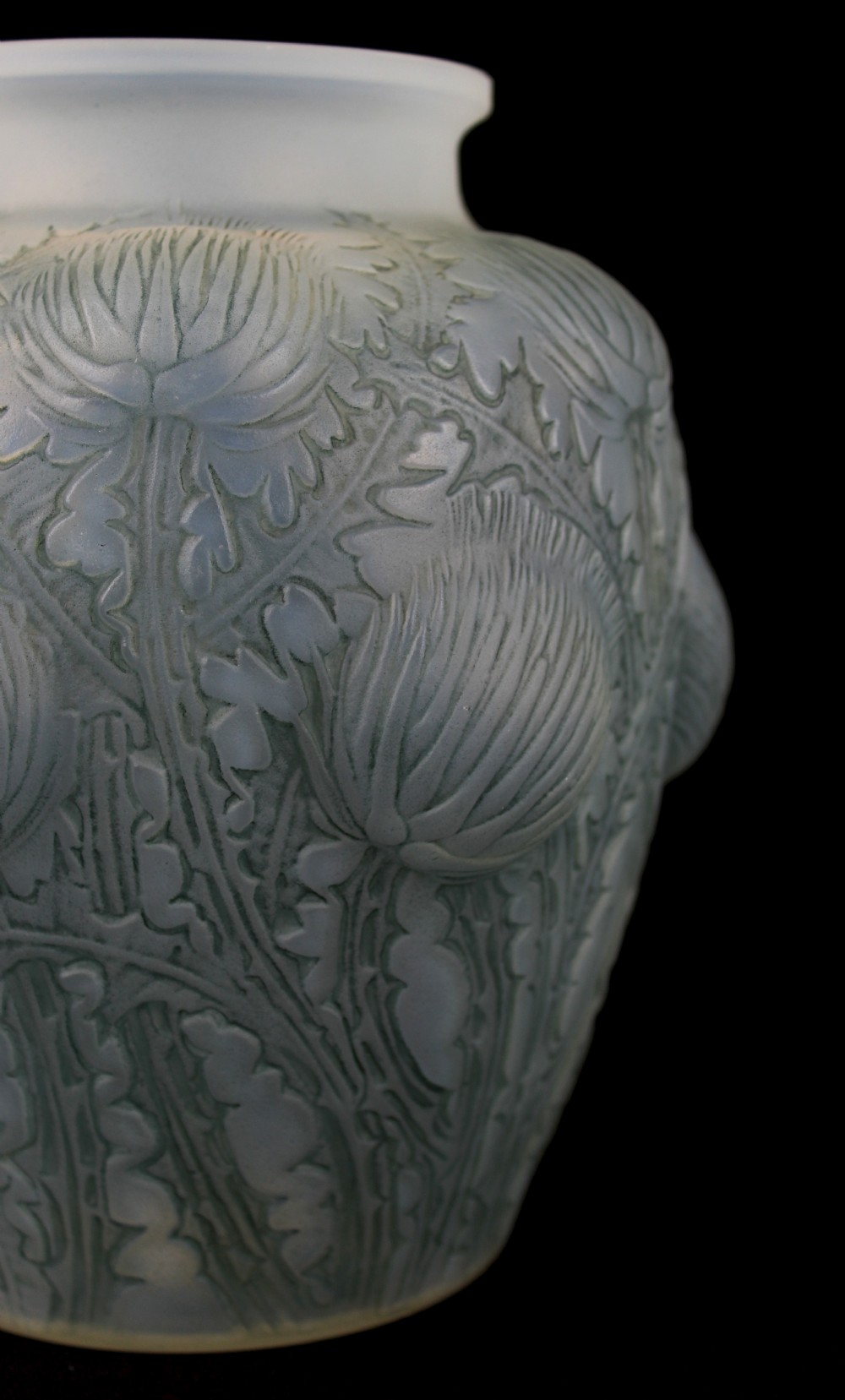 An Art Deco opalescent frosted glass vase featuring relief-moulded thistle motifs with translucent blue tones. View IV