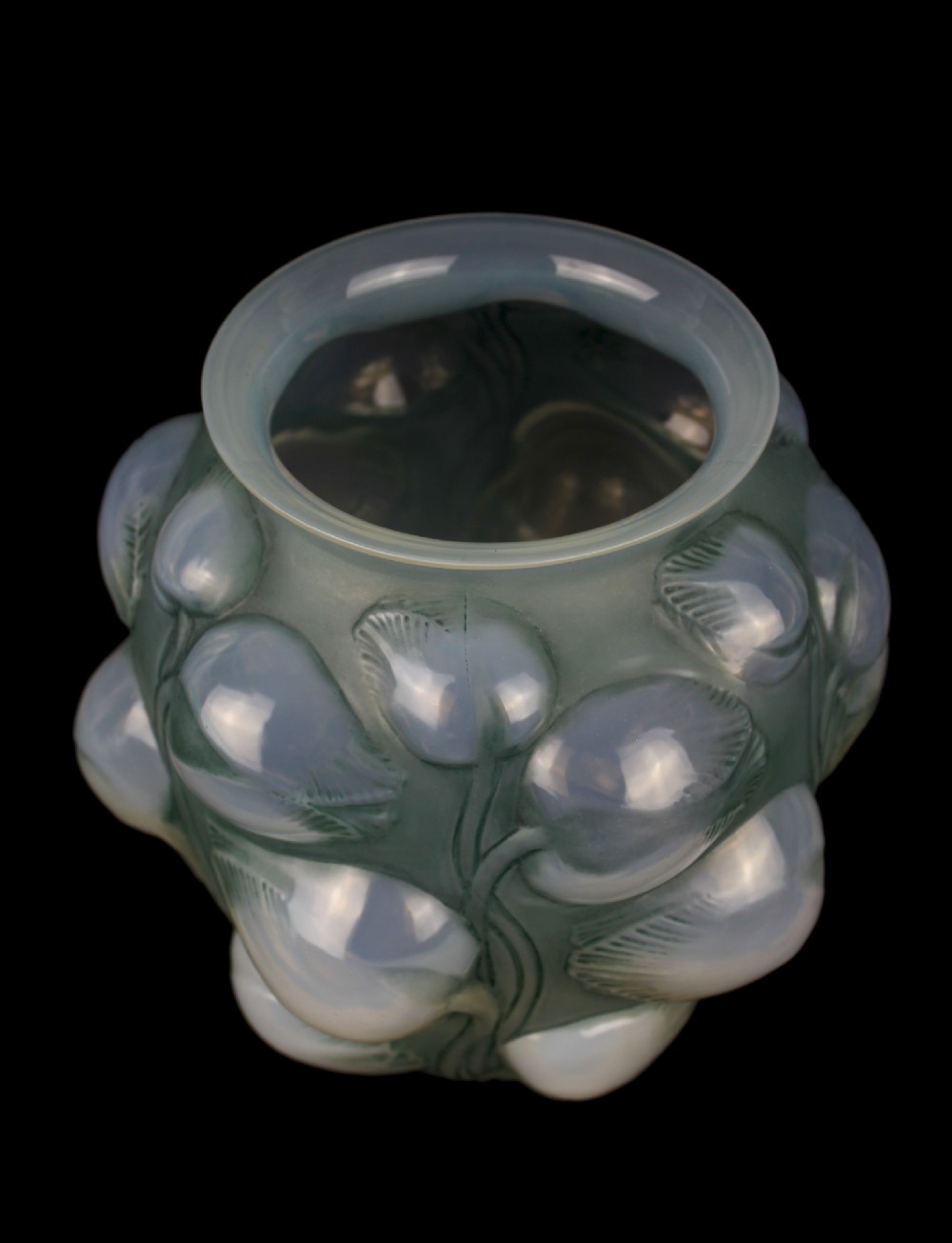 An Art Deco opalescent glass vase featuring high-relief moulded tulip buds and leaf detailing. View III