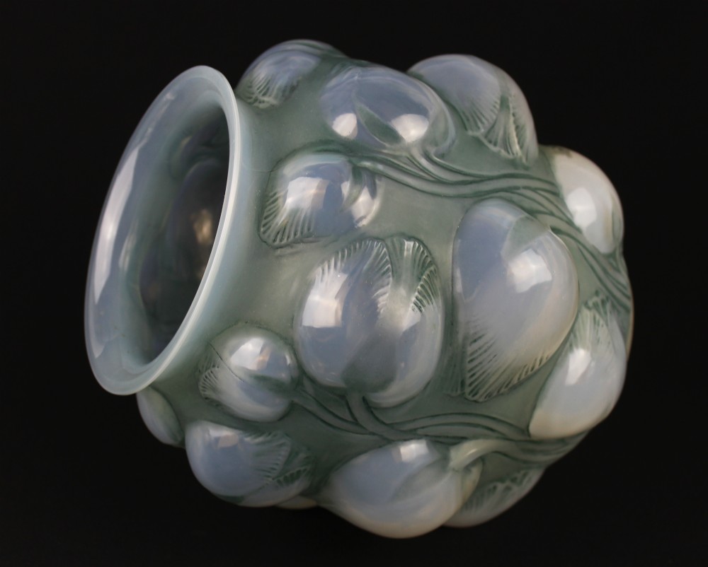 An Art Deco opalescent glass vase featuring high-relief moulded tulip buds and leaf detailing. View IV