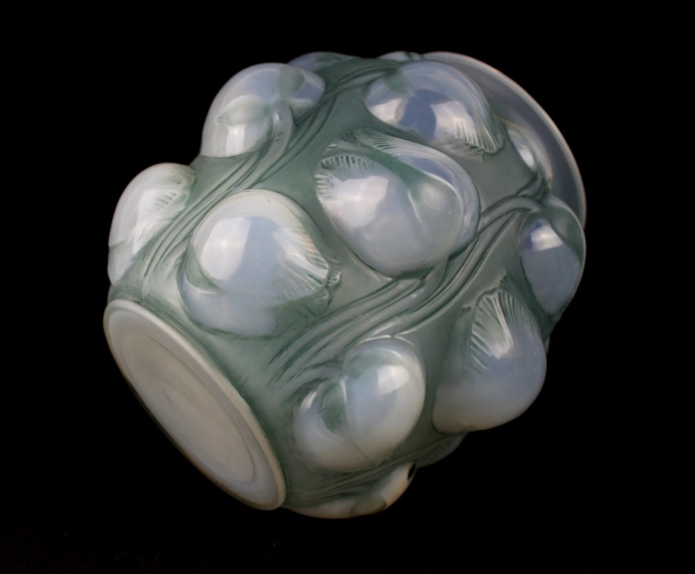 An Art Deco opalescent glass vase featuring high-relief moulded tulip buds and leaf detailing. View V