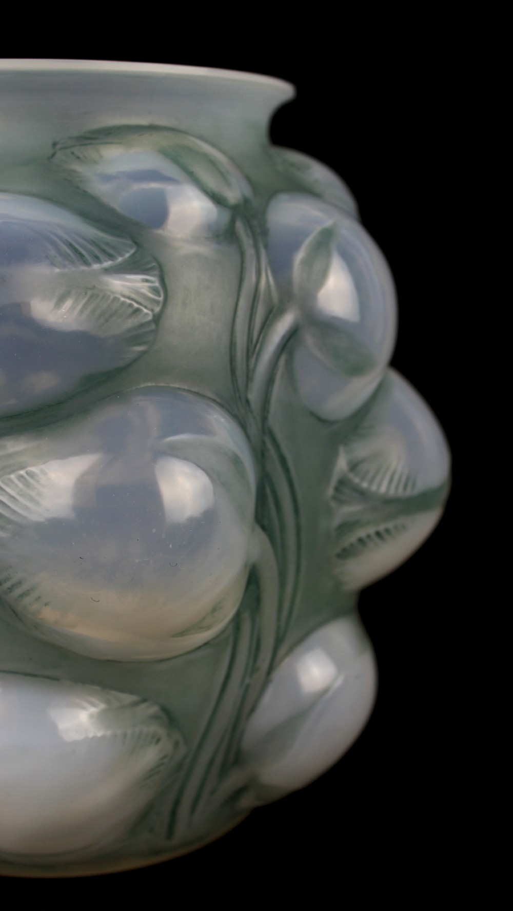 An Art Deco opalescent glass vase featuring high-relief moulded tulip buds and leaf detailing. View VIII