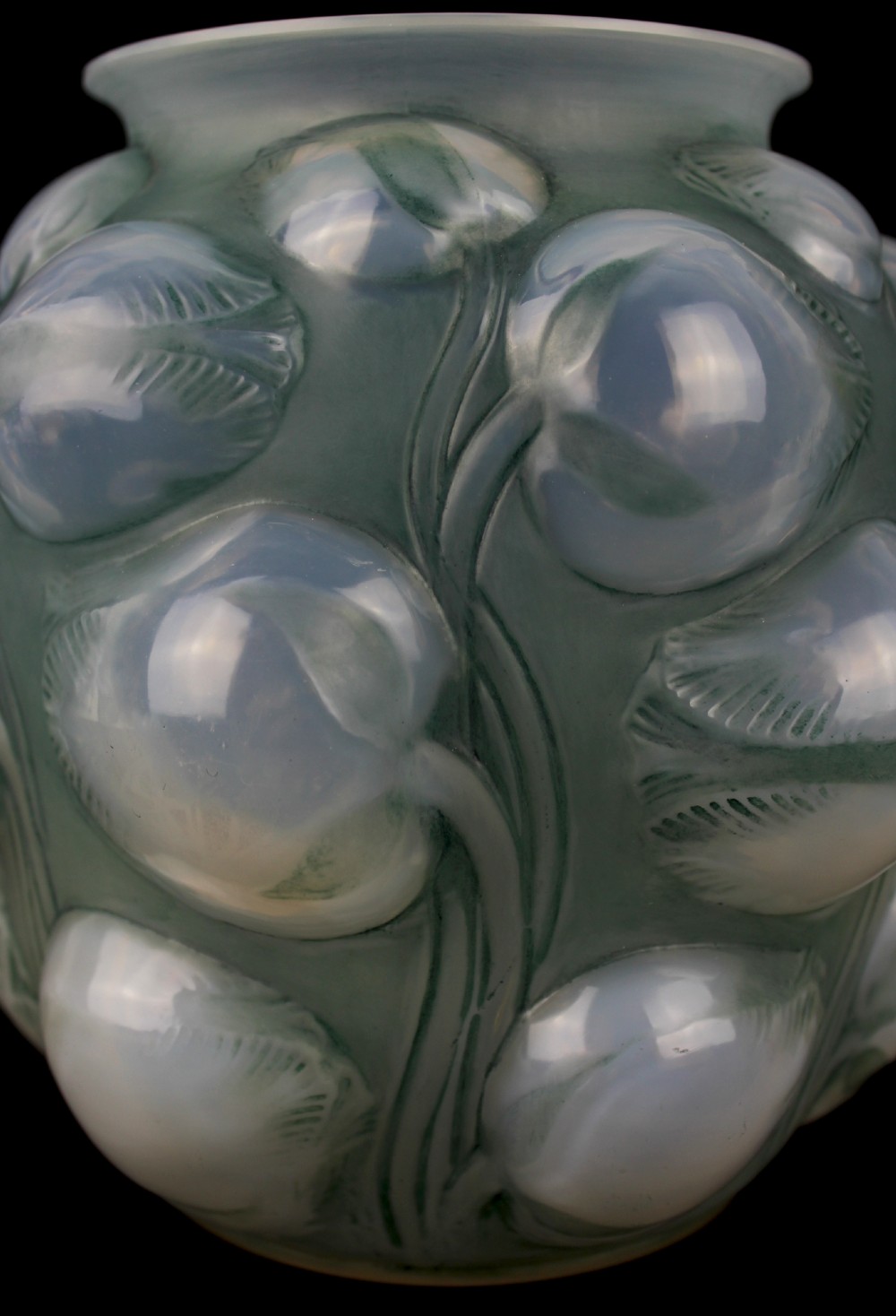 An Art Deco opalescent glass vase featuring high-relief moulded tulip buds and leaf detailing. View IX