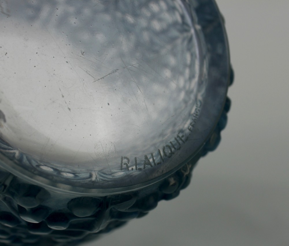 An Art Deco Rene Lalique Saint Tropez vase in clear and frosted blue-stained glass featuring a raised foliage and berry relief pattern. View VI