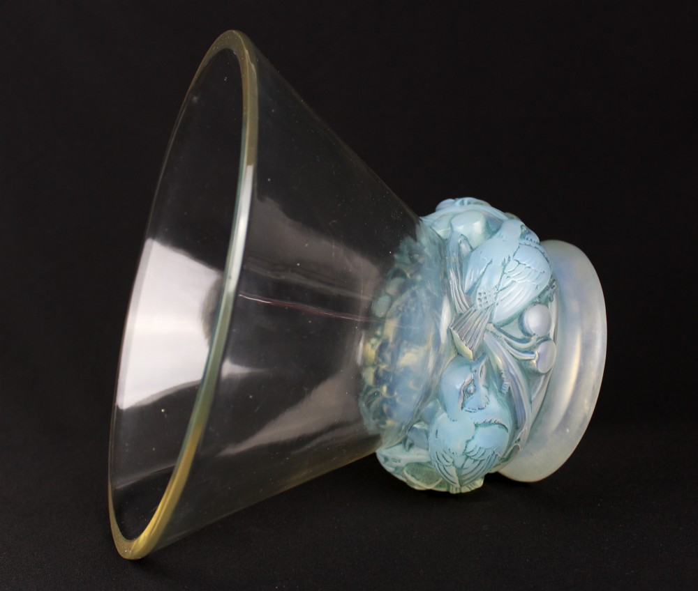 An Art Deco opalescent glass vase featuring a flared clear rim atop a base moulded with finches in foliage. View V