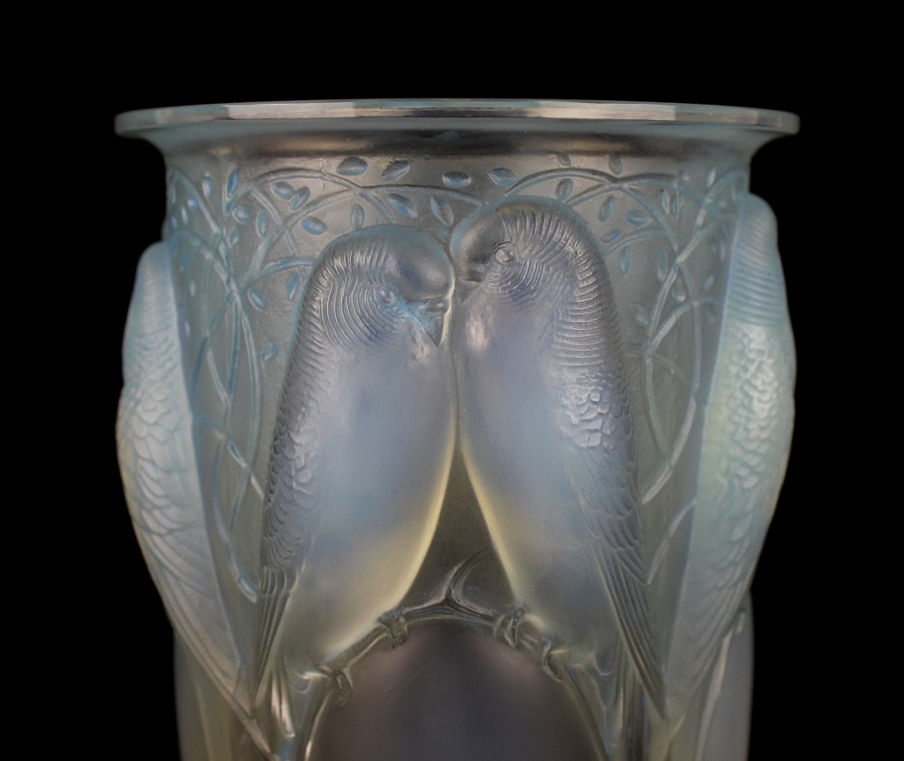 An Art Deco opalescent glass vase moulded in high relief with pairs of parakeets perched among stylized foliage. View III