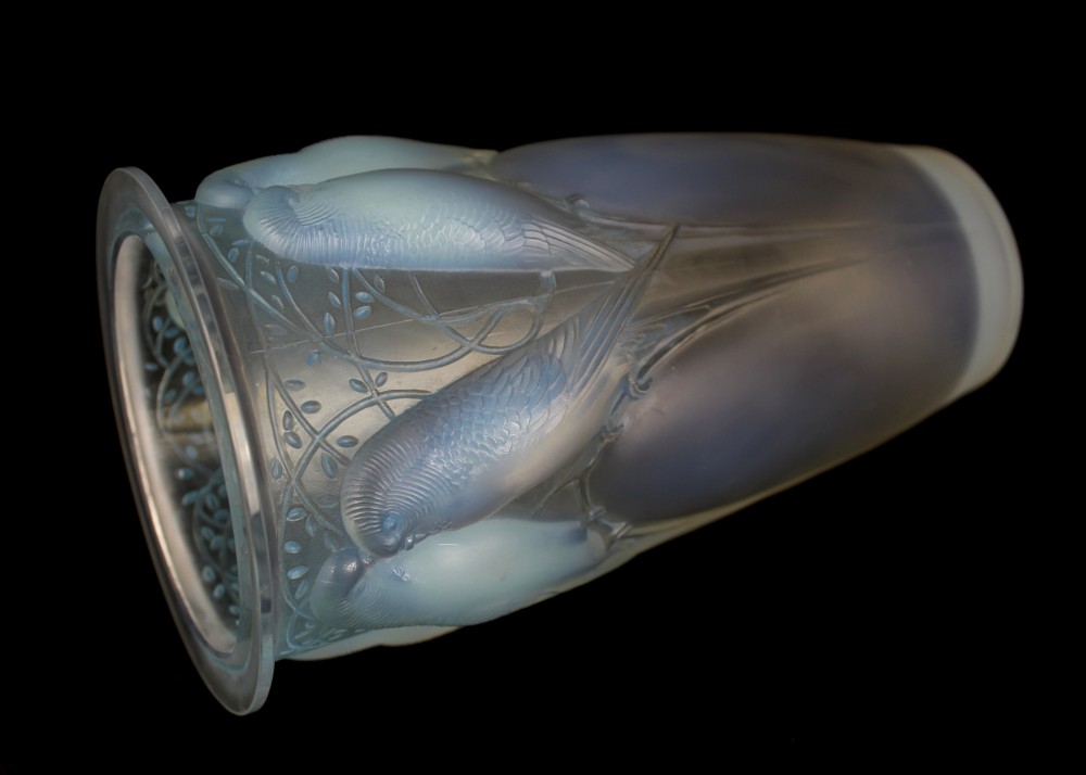 An Art Deco opalescent glass vase moulded in high relief with pairs of parakeets perched among stylized foliage. View V