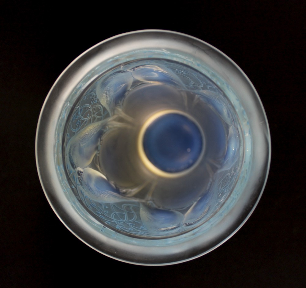 An Art Deco opalescent glass vase moulded in high relief with pairs of parakeets perched among stylized foliage. View VI