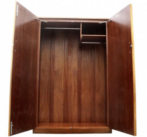 fig 2. A two-door Art Deco wardrobe crafted from light-toned birds eye maple veneer with vertically mounted chrome handles.