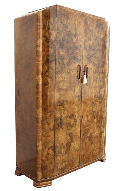 fig 1. An Art Deco two-door wardrobe crafted in richly figured burr walnut veneer with rounded corner edges and wooden handles.