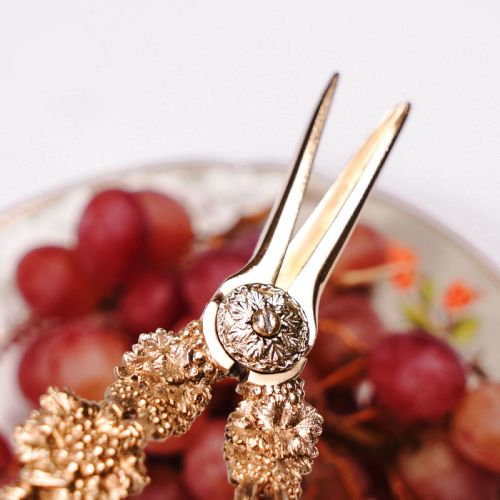 fig 2. A pair of Georgian solid silver gilt grape shears featuring cast grapevine handle motifs.