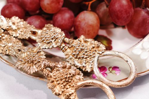 fig 5. A pair of Georgian solid silver gilt grape shears featuring cast grapevine handle motifs.