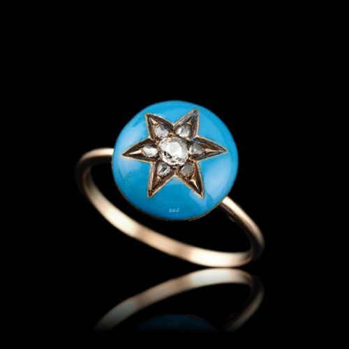 fig 1. A 9ct yellow gold ring featuring a bright blue enamel dome set with a central six-pointed diamond star motif.