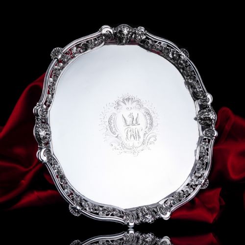 A MAGNIFICENT ANTIQUE GEORGIAN SOLID SILVER SALVER WITH ROCOCO VINE AND FIGURAL MASK DECORATIONS LONDON 1742