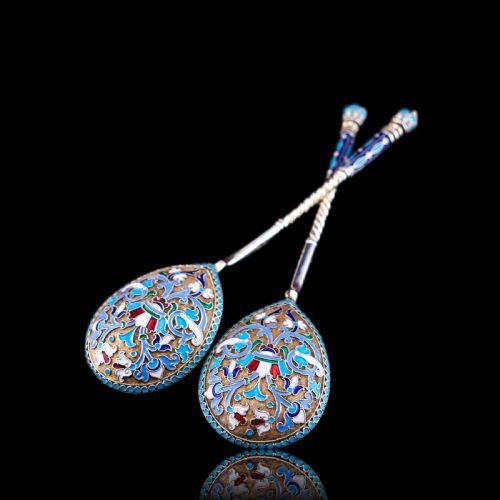 fig 8. A pair of late 19th-century Russian solid silver spoons featuring turquoise, blue, and white cloisonne enamel foliate decoration on silver-gilt teardrop bowls with twisted handles.