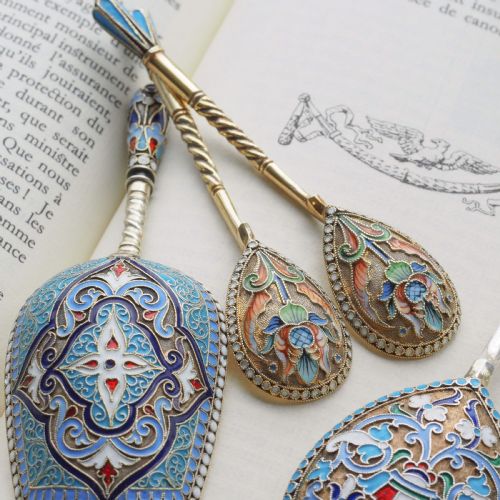 fig 4. A pair of late 19th-century Russian solid silver spoons featuring turquoise, blue, and white cloisonne enamel foliate decoration on silver-gilt teardrop bowls with twisted handles.