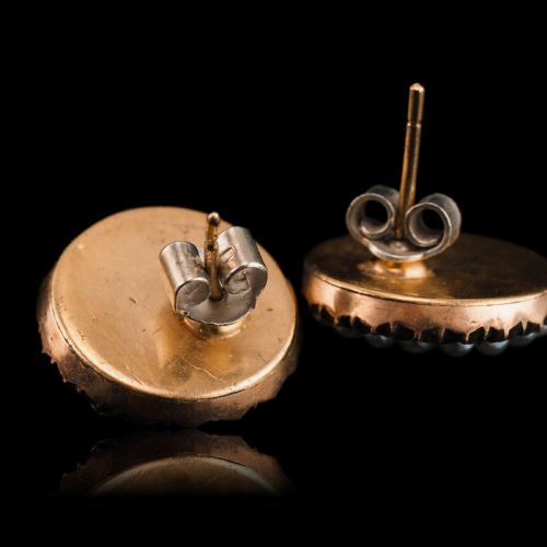 fig 3. A pair of Georgian circular gold earrings featuring cobalt blue guilloche enamel centres surrounded by concentric rings of white enamel and seed pearls.