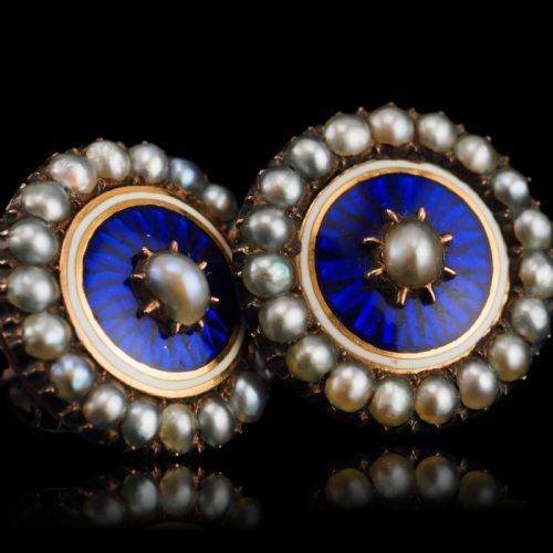fig 4. A pair of Georgian circular gold earrings featuring cobalt blue guilloche enamel centres surrounded by concentric rings of white enamel and seed pearls.