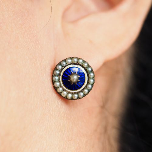 fig 7. A pair of Georgian circular gold earrings featuring cobalt blue guilloche enamel centres surrounded by concentric rings of white enamel and seed pearls.