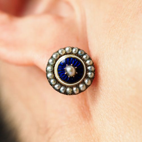 fig 8. A pair of Georgian circular gold earrings featuring cobalt blue guilloche enamel centres surrounded by concentric rings of white enamel and seed pearls.