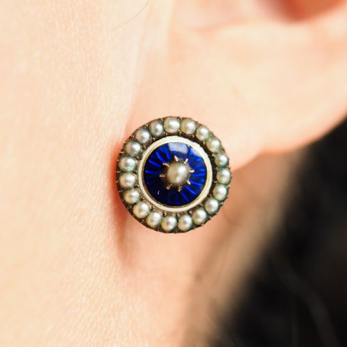 fig 9. A pair of Georgian circular gold earrings featuring cobalt blue guilloche enamel centres surrounded by concentric rings of white enamel and seed pearls.