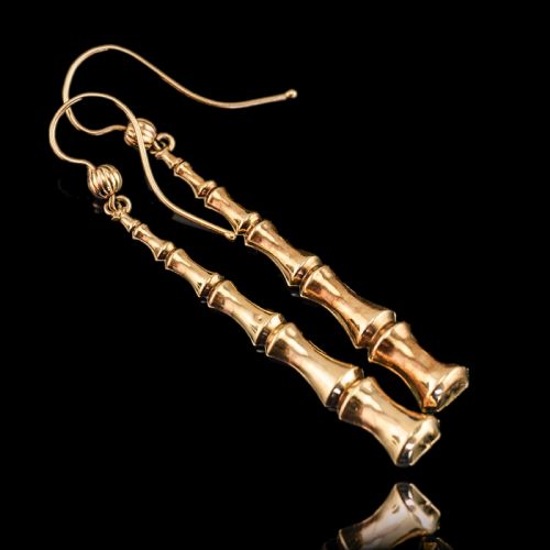 fig 3. A pair of 9ct yellow gold drop earrings designed with stacked bamboo node motifs hanging from shepherd hook ear wires.