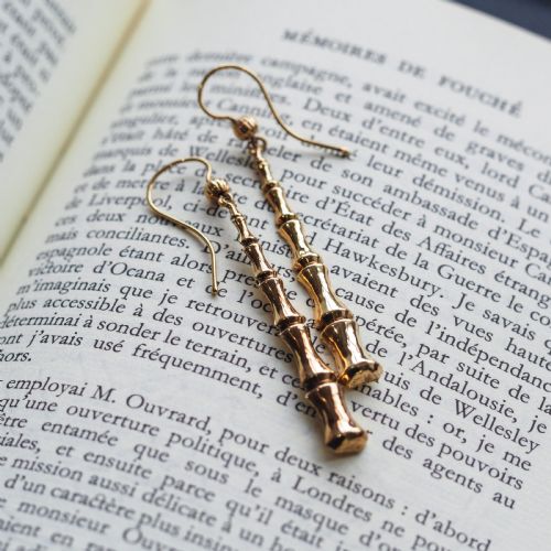 fig 4. A pair of 9ct yellow gold drop earrings designed with stacked bamboo node motifs hanging from shepherd hook ear wires.