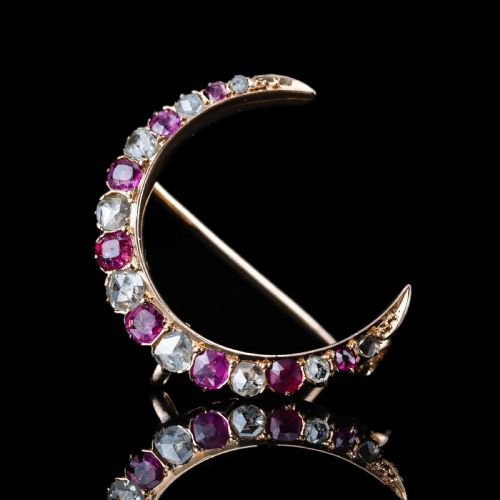 fig 3. An 18K gold Victorian crescent moon brooch set with alternating cushion-cut rubies and old-cut diamonds.