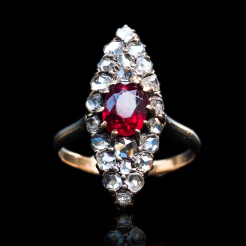 fig 1. An antique late-nineteenth-century French 18k gold navette cluster ring featuring a central oval red ruby surrounded by multiple rose-cut diamonds.