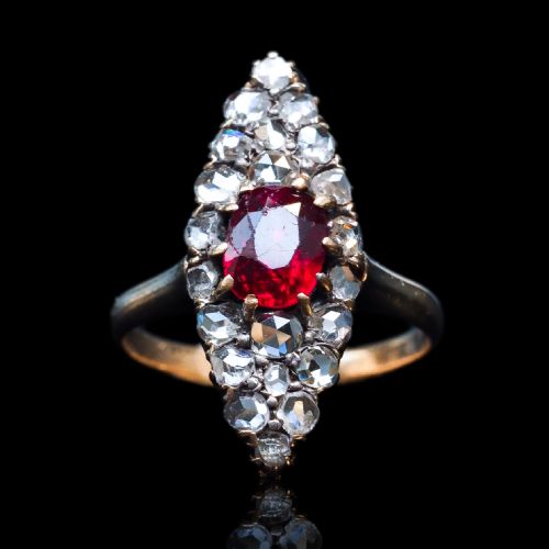 fig 2. An antique late-nineteenth-century French 18k gold navette cluster ring featuring a central oval red ruby surrounded by multiple rose-cut diamonds.