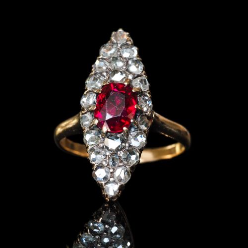 fig 3. An antique late-nineteenth-century French 18k gold navette cluster ring featuring a central oval red ruby surrounded by multiple rose-cut diamonds.