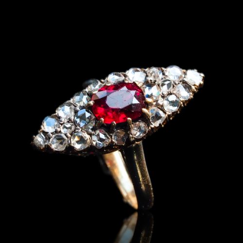 fig 6. An antique late-nineteenth-century French 18k gold navette cluster ring featuring a central oval red ruby surrounded by multiple rose-cut diamonds.